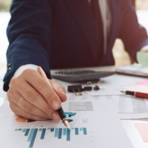 man pointing at graph
